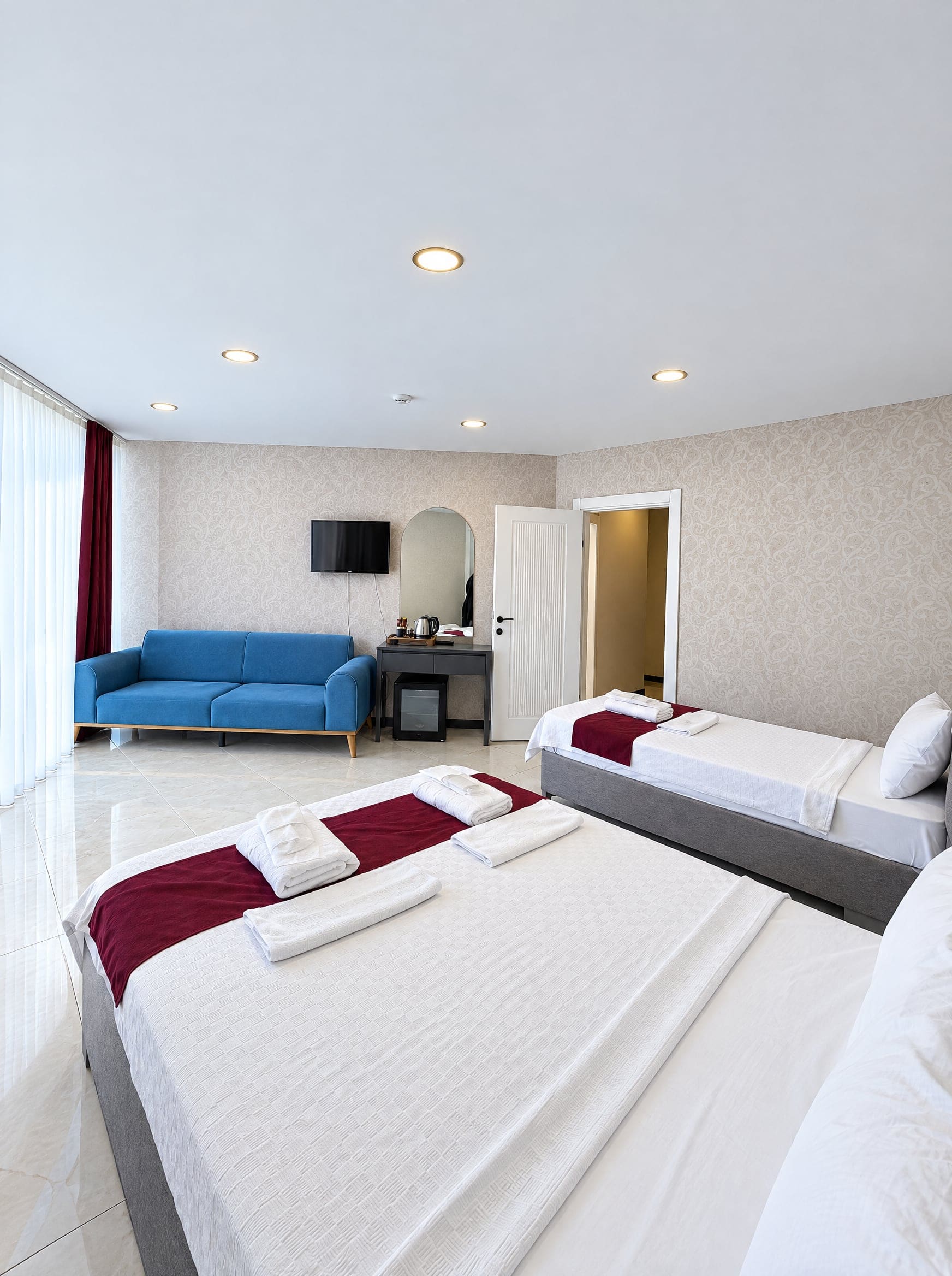 Family Suite: spacious room with two beds, sofa and desk